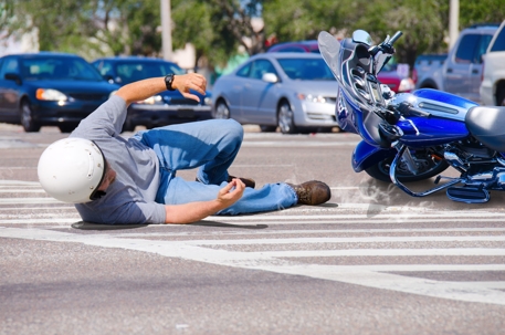 person falling off a motorcycle in an accident